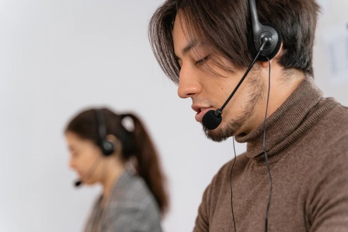 Male call center representative wearing a headset