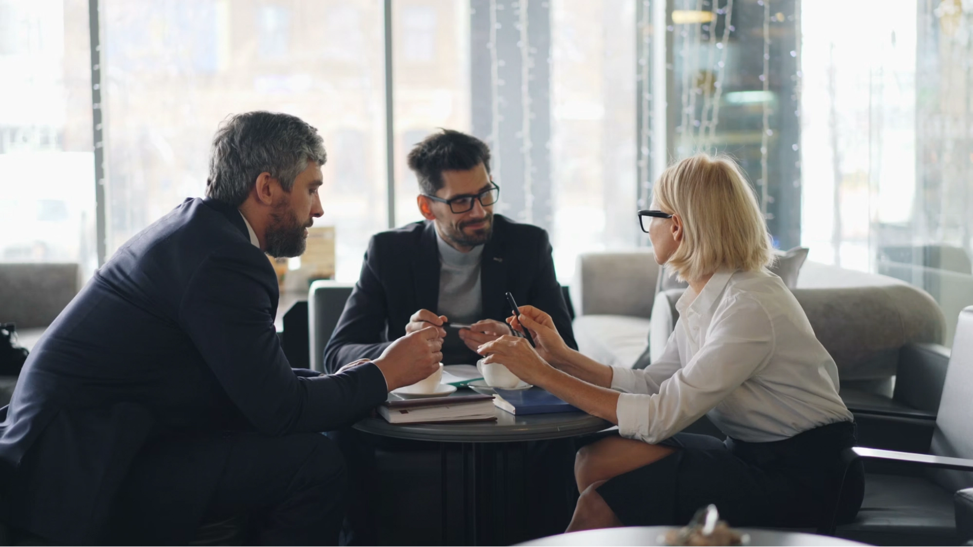 three professionals having a business meeting